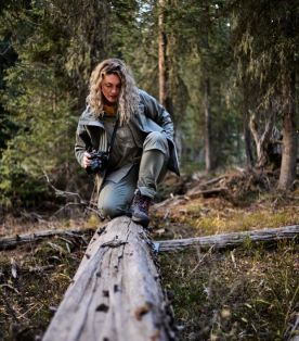 Woman on a tree trunk