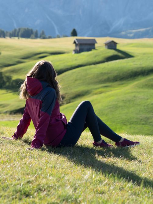 A woman sitting on the grass and relaxing